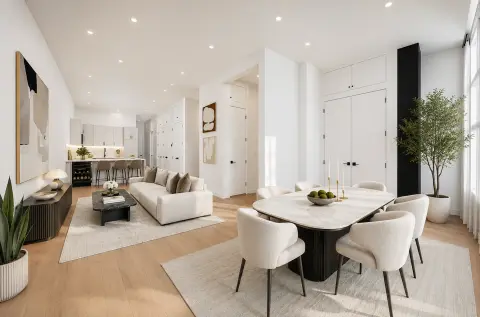 Open-plan living and dining area with wooden floors, white furniture, black dining table, and kitchen visible in background.